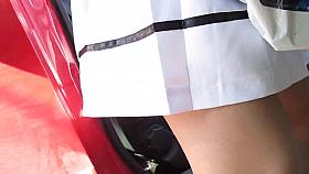 She checks her stockings near car