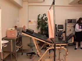 The gynecologist inspects an asian pussy by fingering it