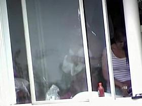 Babe flashed her nude boobs when closing the window