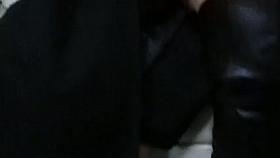 black leather high heel boots and stockings in a bus