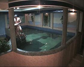 Naked amateur couple having sex in the pool in free voyeur clip