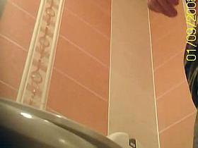 Peeing spy cam catches a mature woman urinating