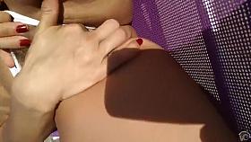 Topless mature woman masturbates at the beach