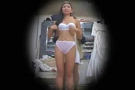 Asian bride spied in lingerie trying on the luxurious dressed