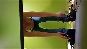 Pregnant girl strips out of her clothes in the changing booth