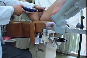 Awesome Asian babe drilled with a dildo during pussy exam