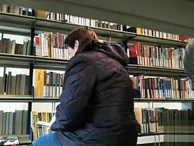 Masturbating next to a woman in the bookstore