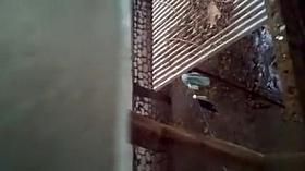 Spying on a topless girl showering outdoors