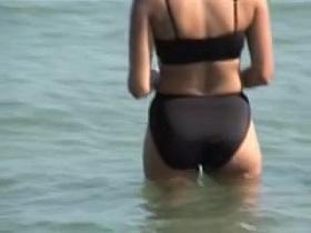 Spy cam of skillful hunter shooting video on the beach 06h