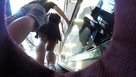 Upskirt of girl with black dress and boyfriend