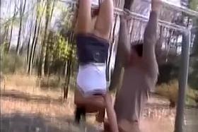 Upside down blowjob outdoors from an athletic girl