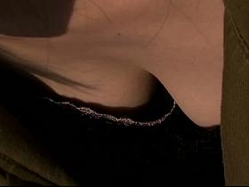 Japanese dark haired downblouse wearing a revealing black dress