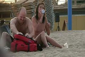 Attractive naked people on the street side nude beach tease each other