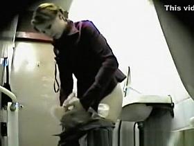 Girl Changes Pad In Public Toilet