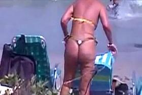 sexy mature thong bikini with NOT her daughter on beach 2014