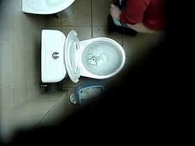 A hidden spy cam catches a chick pissing