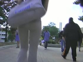 A brunette with appetizing ass in the street candid video