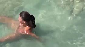 Girl masturbates in ocean after sex