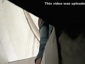 Asian tourist taking pee