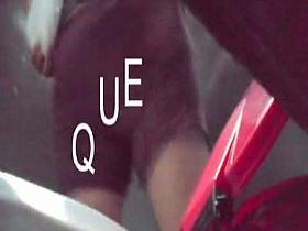 This mature babe is pissing in the public toilet with a cam