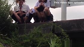 Teens peeing in field