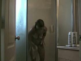 This awesome babe looks like is having a very hot shower