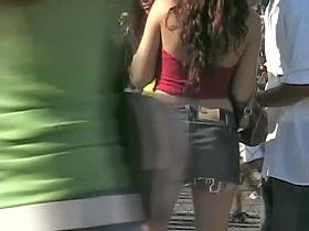 Street candid with young bimbos in short jeans skirt