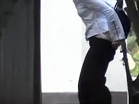 Girl squats to pee outdoors