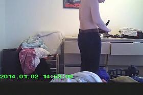 Wife in bedroom dressing her clothes