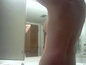 Kathy naked in front of the mirror