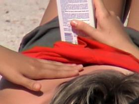 Lying on the beach babe pinches her nips downblouse