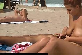 Busty redhead at nudist beach