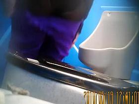 Purple pants woman pissing