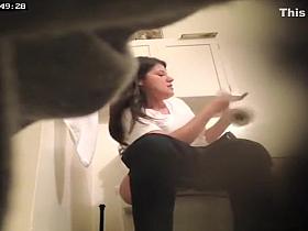 Ten pulling down her pants to piss