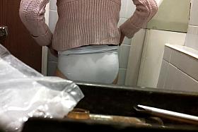 Female bent over the bowl and shot on the toilet cam