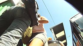 Awesome bum is filmed walking through summer streets