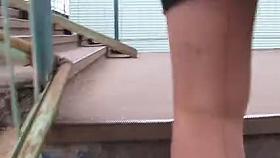 Girl in seamed stockings going upstairs