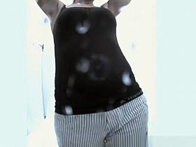 Chubby woman dressing in beach cabin